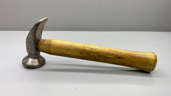 Silversmith, Jewellers and Coppersmith Hammer which is in Good Condition is 9 1/2" long with a 3 3/4" wide head and a 1 3/4" round face, has OM